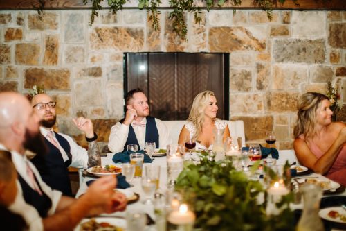 Great food and drink is important when choosing a venue. This photo depicts a family enjoying meal on wedding day in Grand Hall at Bold North Cellars.